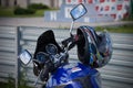 Motorcycle helmet hanging on the handlebars