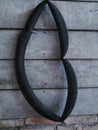 a motorcycle inner tube hanging on an old plank wallbackground