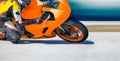 Motorcycle leaning into a fast corner on race track Royalty Free Stock Photo