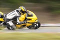 Motorcycle leaning into a fast corner on track