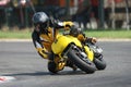 Motorcycle leaning into a fast corner on track. Sport Biker Racing on Road