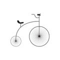 Silhouette of an old vintage bicycle in black. The design is suitable for decoration, a signboard, a logo