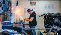 Motorcycle mechanic using a grinder Royalty Free Stock Photo