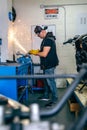 Motorcycle mechanic using a grinder Royalty Free Stock Photo