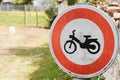 Motorcycle moped prohibited traffic road sign No scooter motorbike or no parking panel round red white Royalty Free Stock Photo