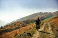 Motorcycle on a mountain dirt road in autumn Royalty Free Stock Photo