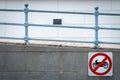 Motorcycle no entry sign install in front of tunnel under the road. Traffic sign to prohibit motorcycle. Restrictive signs. Ramp a