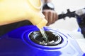 Motorcycle oil refill to tank Royalty Free Stock Photo