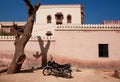 Motorcycle parked near the stone wall