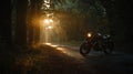 Vintage Motorcycle on a Sun-Kissed Forest Road at Sunrise Royalty Free Stock Photo