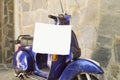Motorcycle parked with a shopping bag hanging