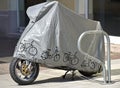 Motorcycle at the parking lot covered with protector foil