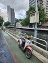 Motorcycle in a pathway in bangkok river