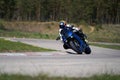 Motorcycle practice leaning into a fast corner on track Royalty Free Stock Photo