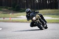 Motorcycle practice leaning into a fast corner on track Royalty Free Stock Photo
