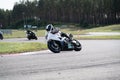 Motorcycle practice leaning into a fast corner on track Royalty Free Stock Photo