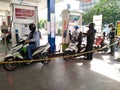 Motorcycle queues that are refueling, at refueling stations