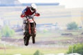 A motorcycle racer in a jump in the air. The view is directly Selective focus. Copy space