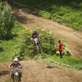 Motorcycle racer overcomes motocross track Royalty Free Stock Photo