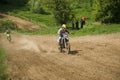 Motorcycle racer overcomes motocross track Royalty Free Stock Photo