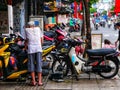 Motorcycle repair on the sidewalk of HCMC Vietnam Royalty Free Stock Photo