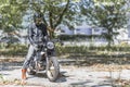 Motorcycle rider on custom made scrambler style cafe racer in th Royalty Free Stock Photo