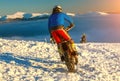 Motorcycle rider extreme sport biker on winter snowy mountains