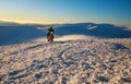 Motorcycle rider extreme sport biker on winter snowy mountains