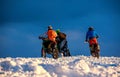 Motorcycle rider extreme sport biker on winter snowy mountains