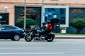 motorcycle rider on Harley Davidson motorbike riding fast at city street