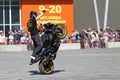 A motorcycle rider make wheelie on the bike