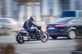 Motorcycle rider on a powerful motorcycle in the city traffic in motion blur. Moscow, Russia - April 4, 2019