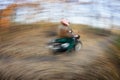 Motorcycle riding in a city park on a lovely autumn/fall day (motio