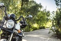 Motorcycle on the road with a helmet the handlebars.