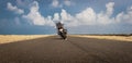 Motorcycle on road with sky and Ridding love message