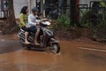 Motorcycle runs through monsoon flood