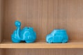 Motorcycle scooter and Car ceramic pottery doll home interior and souvenirs display on wooden shelf for living decoration building