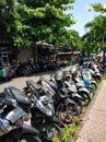 Motorcycle and scooter parking near the market Denpasar Royalty Free Stock Photo