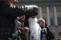 Background photo: biker Santa Claus and people with him, close-up