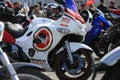 Suzuki white sports motorcycle with different logos, close-up Royalty Free Stock Photo