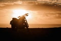 Motorcycle silhouette in the background of bright sunset in Spain