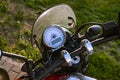 Motorcycle speedometer and dashboard with wind glass. Shiny, custom, stylish, yellow motorbike panel fragment close up Royalty Free Stock Photo