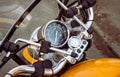 Motorcycle speedometer and dashboard with wind glass. Shiny, custom, stylish, yellow motorbike panel fragment Royalty Free Stock Photo
