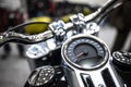 Motorcycle speedometer in the reflection of chrome parts
