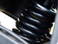 Motorcycle spring and shock absorber close-up. Motorcycle vibration system Royalty Free Stock Photo