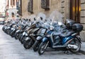 Motorcycle squad parked their iron horses outside in Florence, Italy