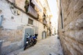 Motorcycle standing at the empty street of old italian town Bari, Puglia, South Italy