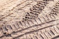 Motorcycle tire track print on sand with selective focus Royalty Free Stock Photo