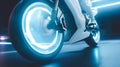 Motorcycle wheel rim in motion with led lights white spokes. Royalty Free Stock Photo