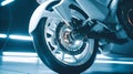 Motorcycle wheel rim in motion with white spokes. Royalty Free Stock Photo
